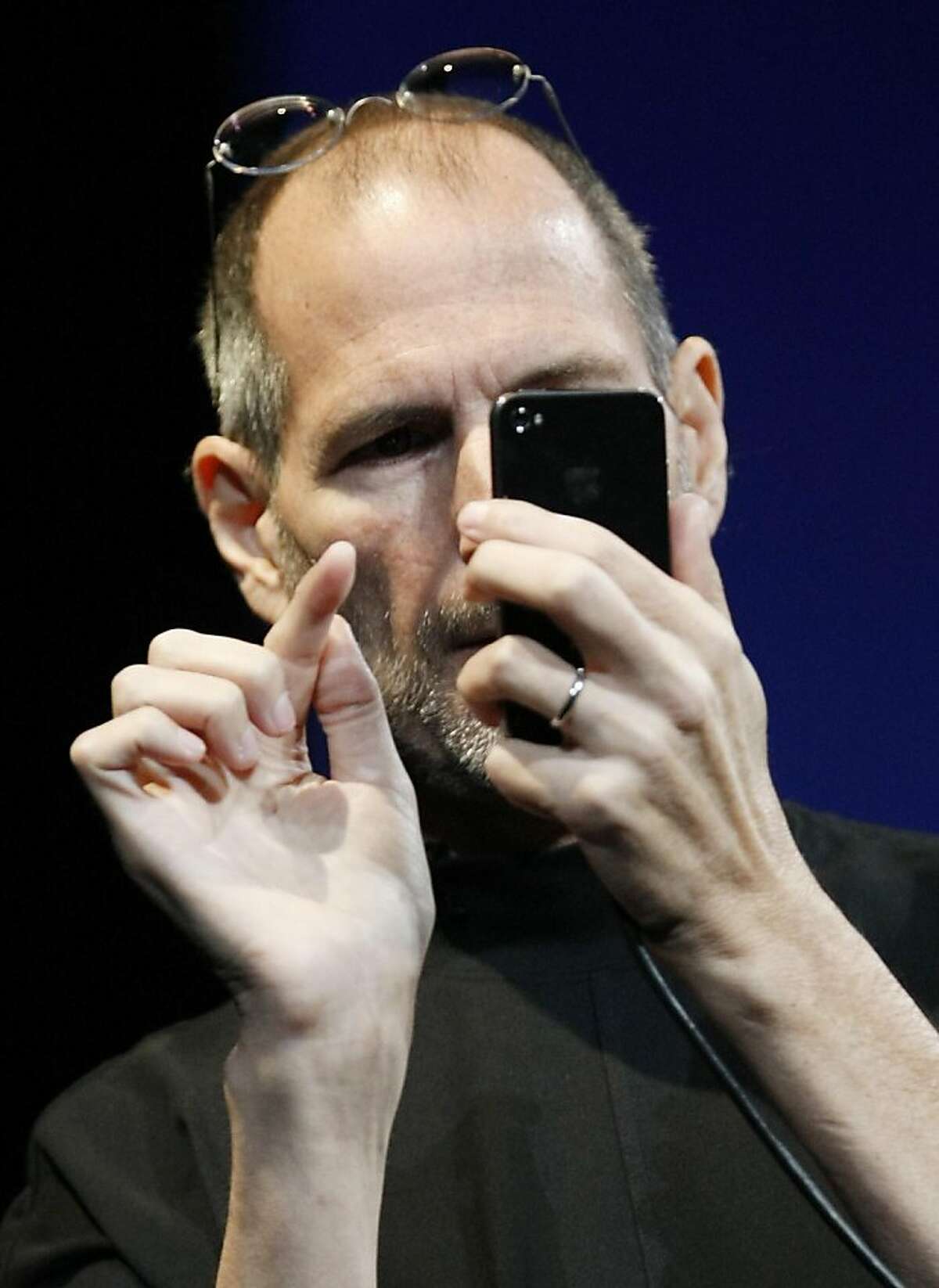 In this June 7, 2010 photo, Apple CEO Steve Jobs uses the new iPhone 4, at the Apple Worldwide Developers Conference in San Francisco. Apple said Friday, July 2, it is "stunned" to find that its latest iPhone model uses a "completely wrong" formula to show how many bars of signal strength it's getting. (AP Photo/Paul Sakuma) Ran on: 07-13-2010 Apples Steve Jobs demos the iPhone 4 in San Francisco. Ran on: 07-13-2010 Apples Steve Jobs demos the iPhone 4 in San Francisco.