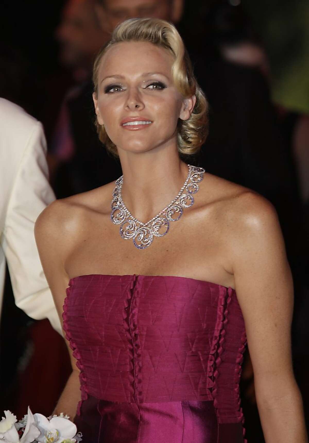 Prince Albert II of Monaco's wife Princess Charlene takes part to the "Red Cross Gala", Friday, Aug. 5, 2011, in Monaco. (AP Photo/Lionel Cironneau)