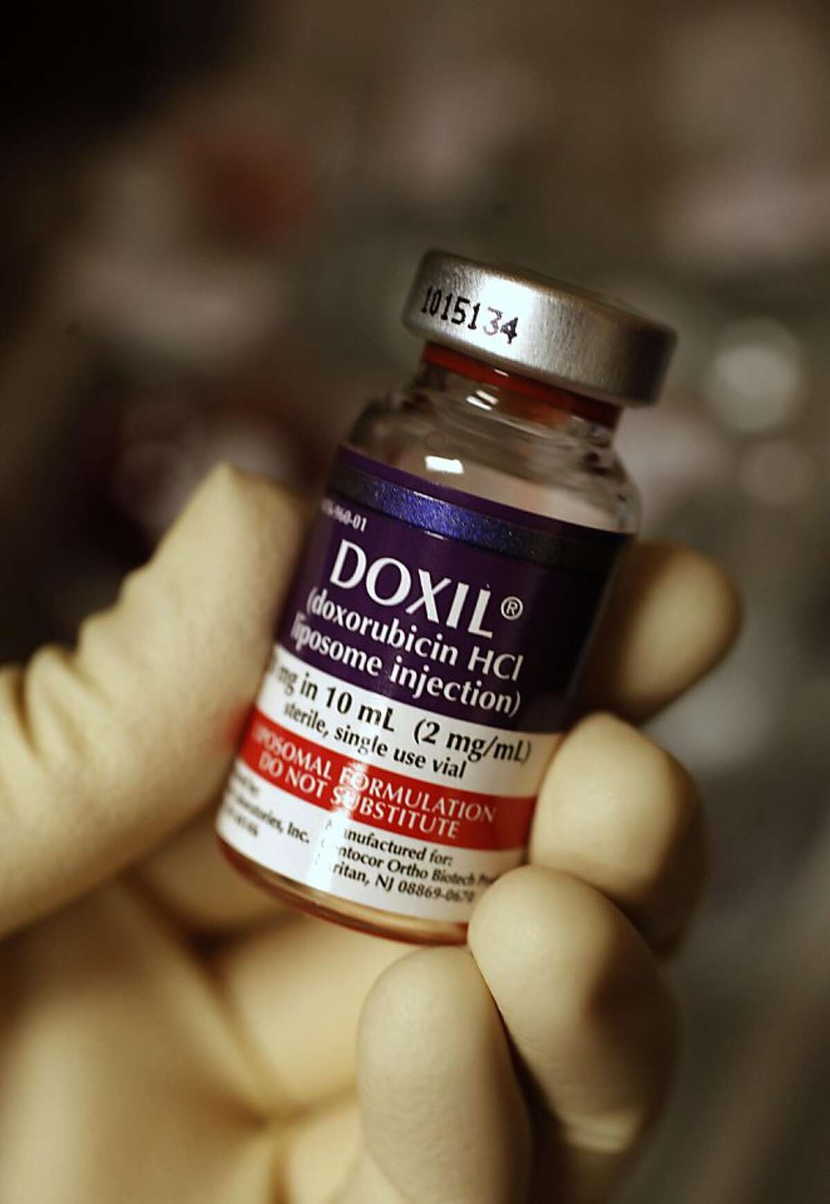 Michelle Taymuree, clinical pharmacy manager, at the Diablo Valley Oncology/Hematology, in Pleasant Hill, Ca. on Tuesday August 9, 2011, holds a vial of Doxil, a cancer drug . Doxil is one of the drugs which is in short supply and they are having trouble acquiring for their patients.