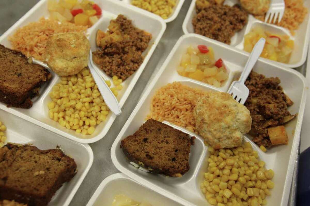 Meals are prepared to be served for lunch at St Vinny's Bistro inside the Haven for Hope campus, where an average 60,000 meals per month are served out of a small space with limited resources, Friday, October 28, 2011. (Jennifer Whitney/ Special to the San Antonio Express-News)