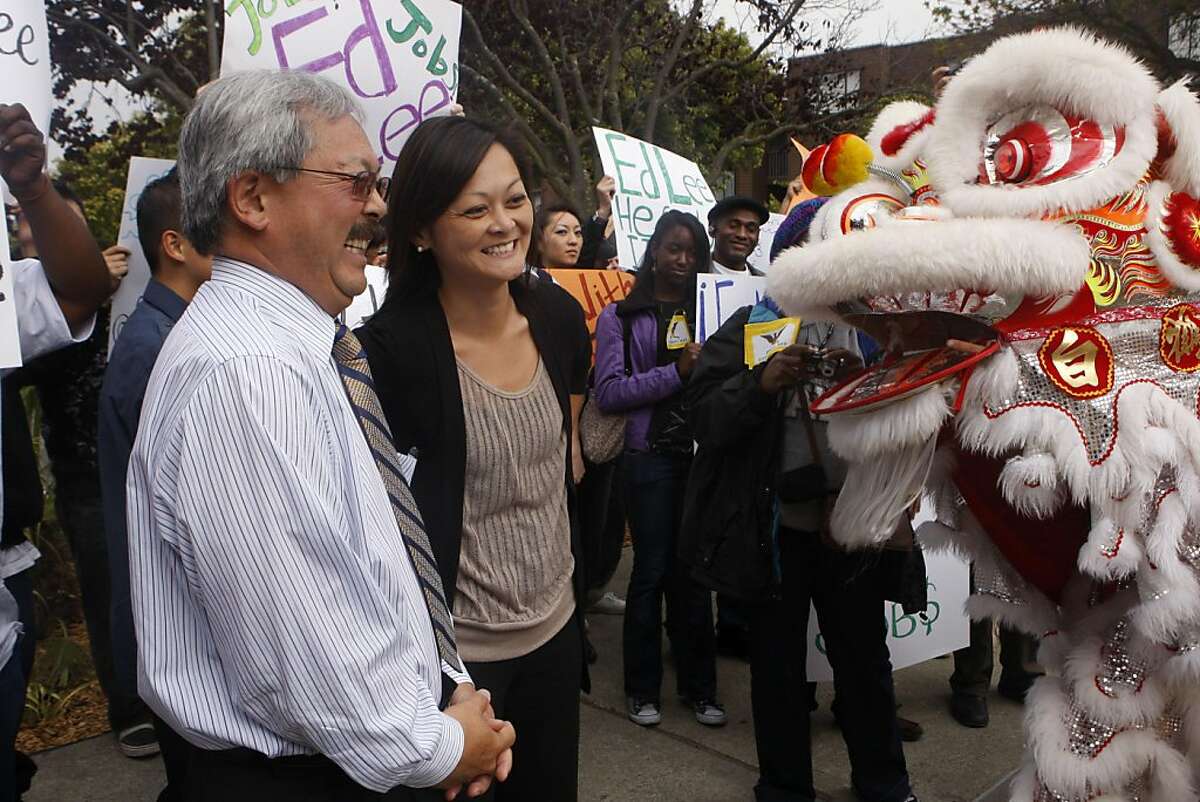 Supervisor Carmen Chu and Mayor Ed Lee enjoy the lion dancers perform before the rally for Lee's campaign outside the Ella Hill Hutch Community Center in San Francisco Calif., on August 11, 2011.