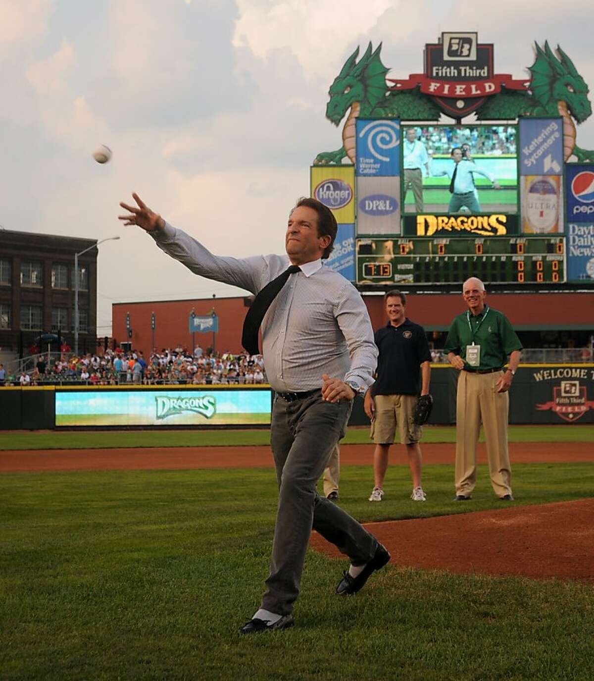 Peter Guber throws out the first pitch in a game for the Dayton Dragons, a Class A minor-league baseball team in the Cincinnati Reds' farm system. Guber is a co-owner of Dragons, as well as the the Golden State Warriors in the NBA. This pitch came before the team's 815th consecutive home sellout, on July 9, 2011, at Fifth Third Field in Dayton, Ohio.