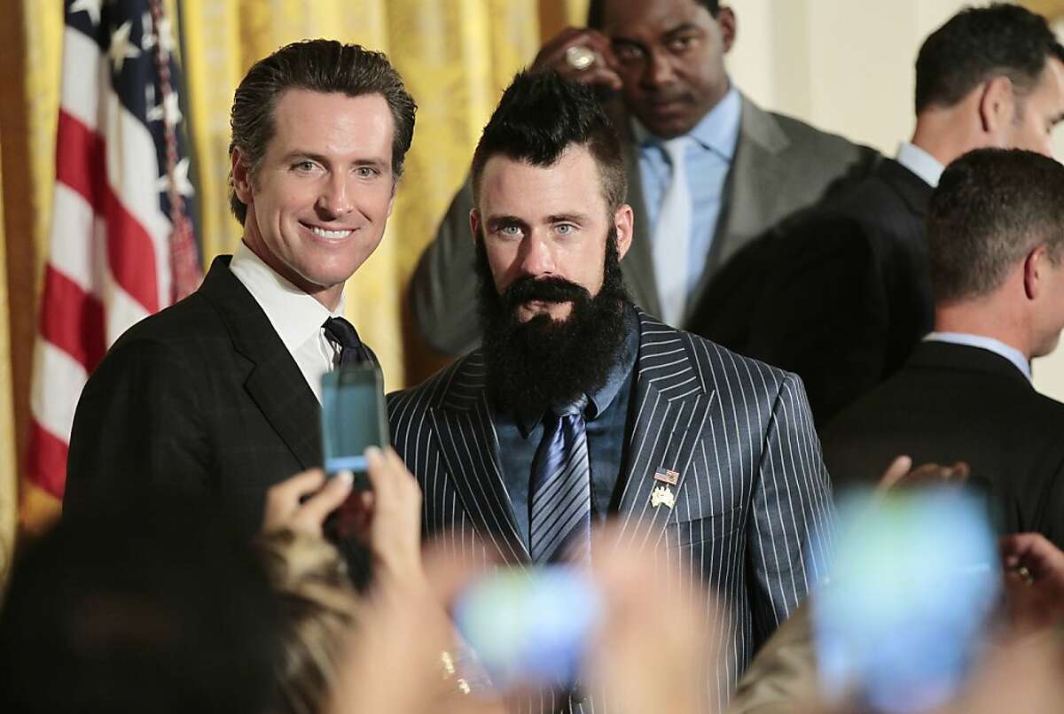 San Francisco Giants baseball pitcher pitcher Brian Wilson, right, California Lt. Gov., and former San Francisco Mayor, Gavin Newsom, left, pose for photos in the East Room of the White House in Washington, Monday, July 25, 2011, during a ceremony honoring the 2010 World Series baseball champions. (AP Photo/Pablo Martinez Monsivais Ran on: 07-26-2011 Lt. Gov. Gavin Newsom, seen with Giants reliever Brian Wilson, was in Washington for meetings anyway, his staff said.