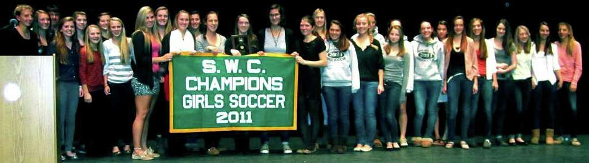 SPECTRUM/The Green Wave girls' soccer side shows off the school's first league championship banner in either boys' or girls' soccer. Nov. 28, 2011 .