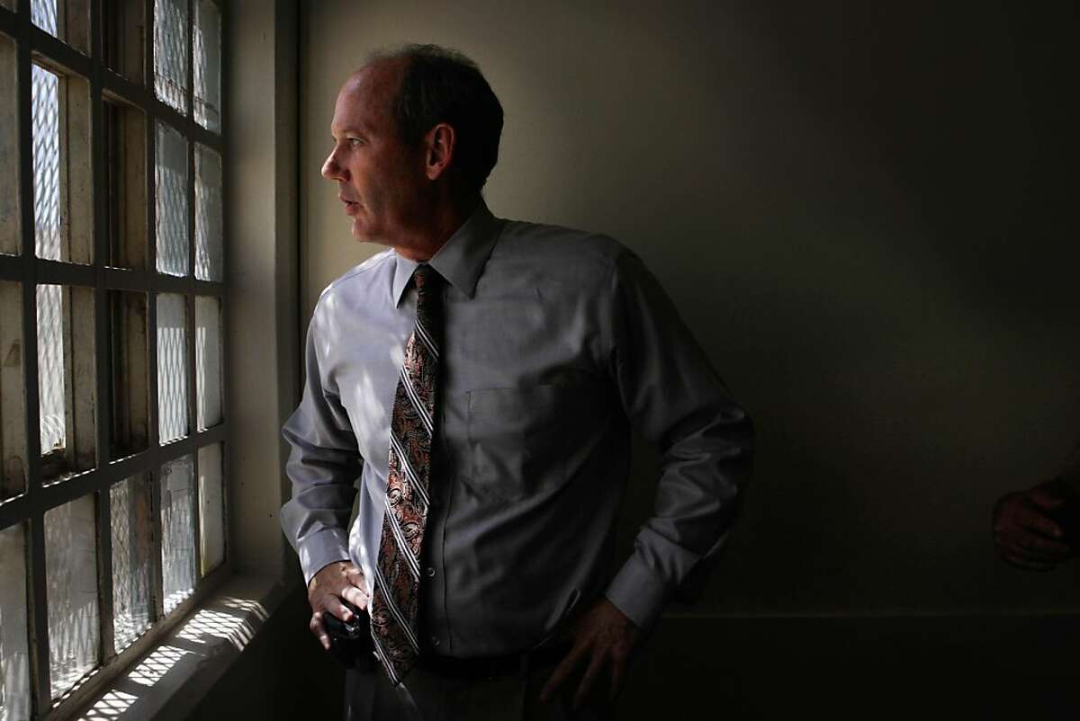 David Silbaugh, California Medical Facility Chief Psychologist looks out a window in Unit 1 at California Medical Center at California Medical Facility on Thursday, August 4, 2011 in Vacaville, Calif.