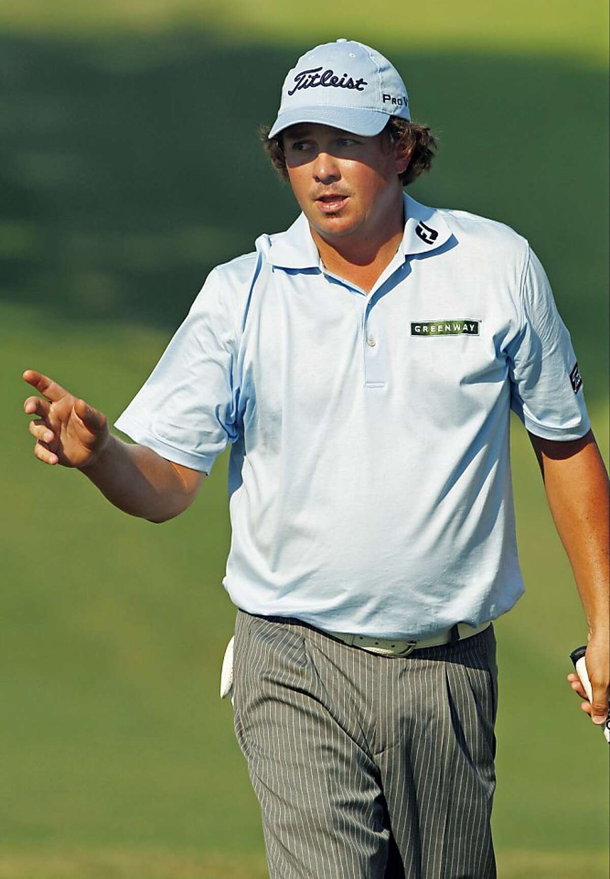 Jason Dufner reacts after making a birdie putt on the ninth hole during the second round of the PGA Championship golf tournament Friday, Aug. 12, 2011, at the Atlanta Athletic Club in Johns Creek, Ga. (AP Photo/Charlie Krupa)