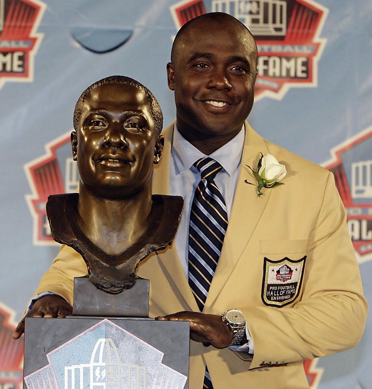 Deion Sanders puts a bandana on a bust of himself during the induction  ceremony at the Pro Football Hall of Fame, Saturday, Aug. 6, 2011, in  Canton, Ohio. (AP Photo/Ron Schwane Stock