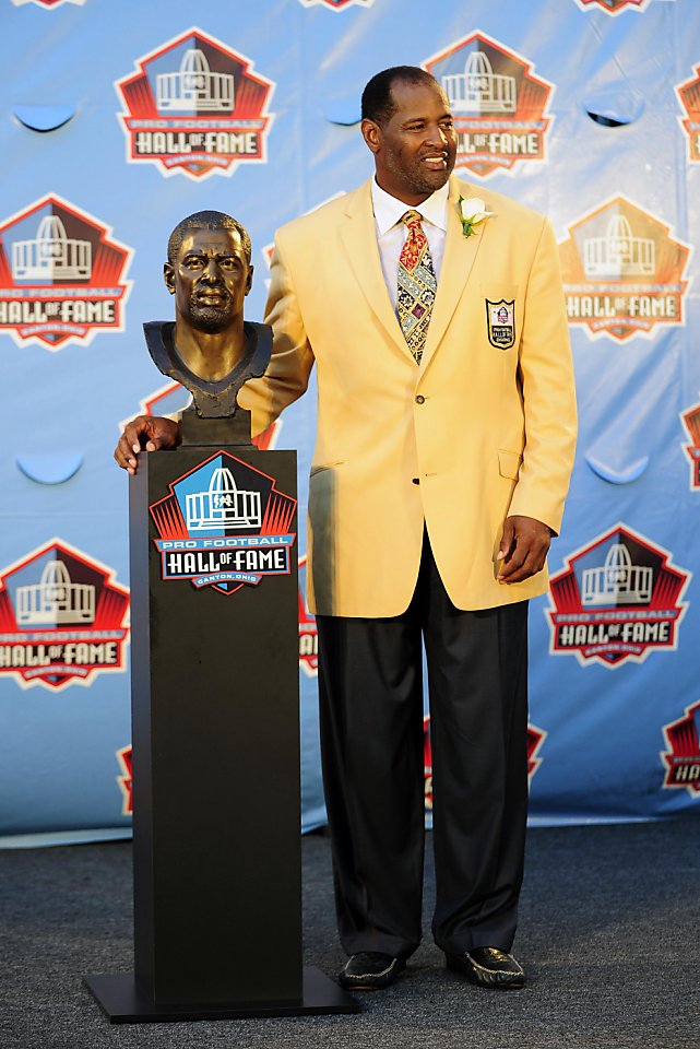 Deion Sanders puts a bandana on a bust of himself during the induction  ceremony at the Pro Football Hall of Fame, Saturday, Aug. 6, 2011, in  Canton, Ohio. (AP Photo/Ron Schwane Stock