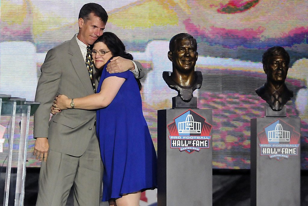 Deion Sanders puts a bandana on a bust of himself during the induction  ceremony at the Pro Football Hall of Fame, Saturday, Aug. 6, 2011, in  Canton, Ohio. (AP Photo/Ron Schwane Stock