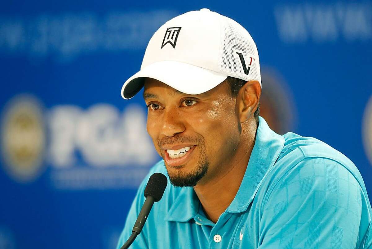 JOHNS CREEK, GA - AUGUST 10: Tiger Woods talks with the media during a press conference after his practice round prior to the start of the 93rd PGA Championship at the Atlanta Athletic Club on August 10, 2011 in Johns Creek, Georgia.