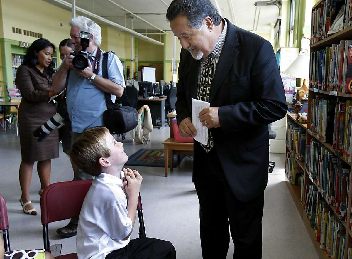 SFUSD Superintendent Carlos Garcia talked with seven year old Jackson Moran before the event.Educational leaders gathered at Leonard R. Flynn elementary school in San Francisco, Calif. Thursday August 11, 2011 to announce that for the fourth year in a row, San Francisco has reduced the number of habitually and chronically absent children enrolled in public schools.