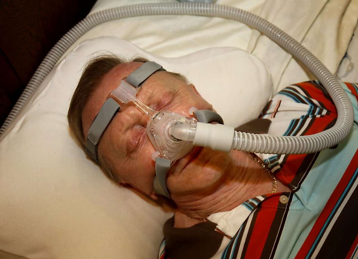 Les Besser demonstrates how he must sleep with CPAP device which pumps fresh air into his lungs. Les Besser, 75, of Los Altos, Calif., suffers from sleep apnea. He runs a sleep apnea support group and uses a CPAP machine to get through the night.
