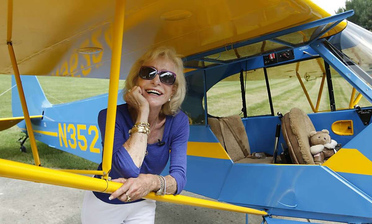 Myrtle Rose, 75, stands by her 1941 Piper J-3 Cub named "Winston" on her property in South Barrington, Ill., Friday, Aug. 5, 2011. The aviation enthusiast was out for a quick flight on Wednesday, Aug. 3 when she saw two F-16 fighter jets out her cockpit window after she strayed into restricted airspace during a visit to Chicago by President Barack Obama. Rose says she’s filed a report with the Federal Aviation Administration explaining she didn’t know she wasn’t supposed to fly in the area that day.