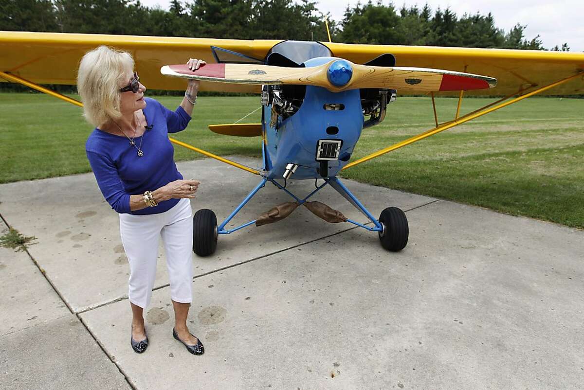 Myrtle Rose, 75, checks out her 1941 Piper J-3 Cub after a brief flight from the airstrip at her home, Friday, Aug. 5, 2011, in South Barrington, Ill. The aviation enthusiast was out for a quick flight on Wednesday, Aug. 3 when she saw two F-16 fighter jets out her cockpit window after she strayed into restricted airspace during a visit to Chicago by President Barack Obama. Rose says she?•s filed a report with the Federal Aviation Administration explaining she didn?•t know she wasn?•t supposed to fly in the area that day.