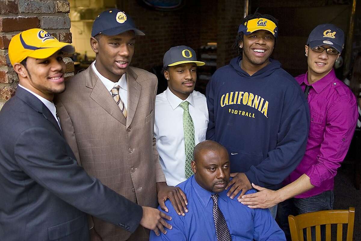 From left, Keenan Allen, Chris McCain, James Scales, Gabe King and Zach Maynard pose for a photo with Otis Yelverton during High School National Signing Day, Wednesday, Feb. 3, 2010 in Greensboro, N.C. (AP Photo/News & Record, Jerry Wolford) Ran on: 02-04-2010 From left, Keenan Allen, Chris McCain, James Scales, Gabe King and Zach Maynard with coach Otis Yelverton during signing day in Greensboro, N.C.
