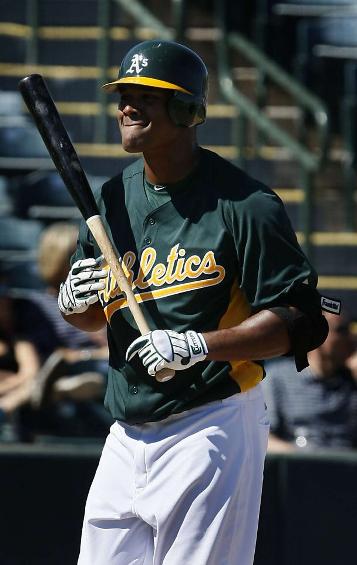 Oakland Athletics' Michael Taylor walks back to the dugout after hitting an infield pop up in the fourth inning of a spring training baseball game against the Cleveland Indians Wednesday, March. 2, 2011 in Phoenix Ariz. The Athletics defeated the Indians 4-3. Ran on: 03-04-2011 Michael Taylor wants to make a big impression this spring, but he has a more basic goal.