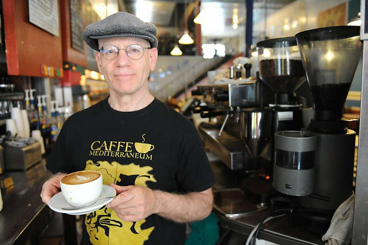 Craig Becker, coowner and manager of Caffe Mediterraneum shows off a capuccino on August 4, 2011. The cafe is the second oldest on the west coast and is also the place where the caffe latte was invented