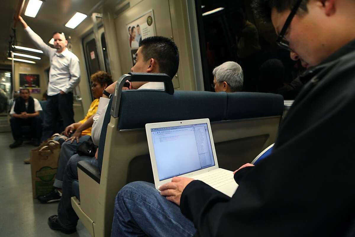 Joery van Druten works on his laptop while traveling on BART in San Francisco Calif., on August 5, 2011.