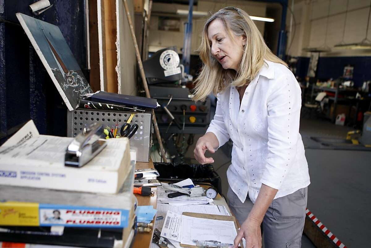 Diane Amble works on a paperwork at her smog shop in San Francisco, Calif., on Friday, July 29, 2011.