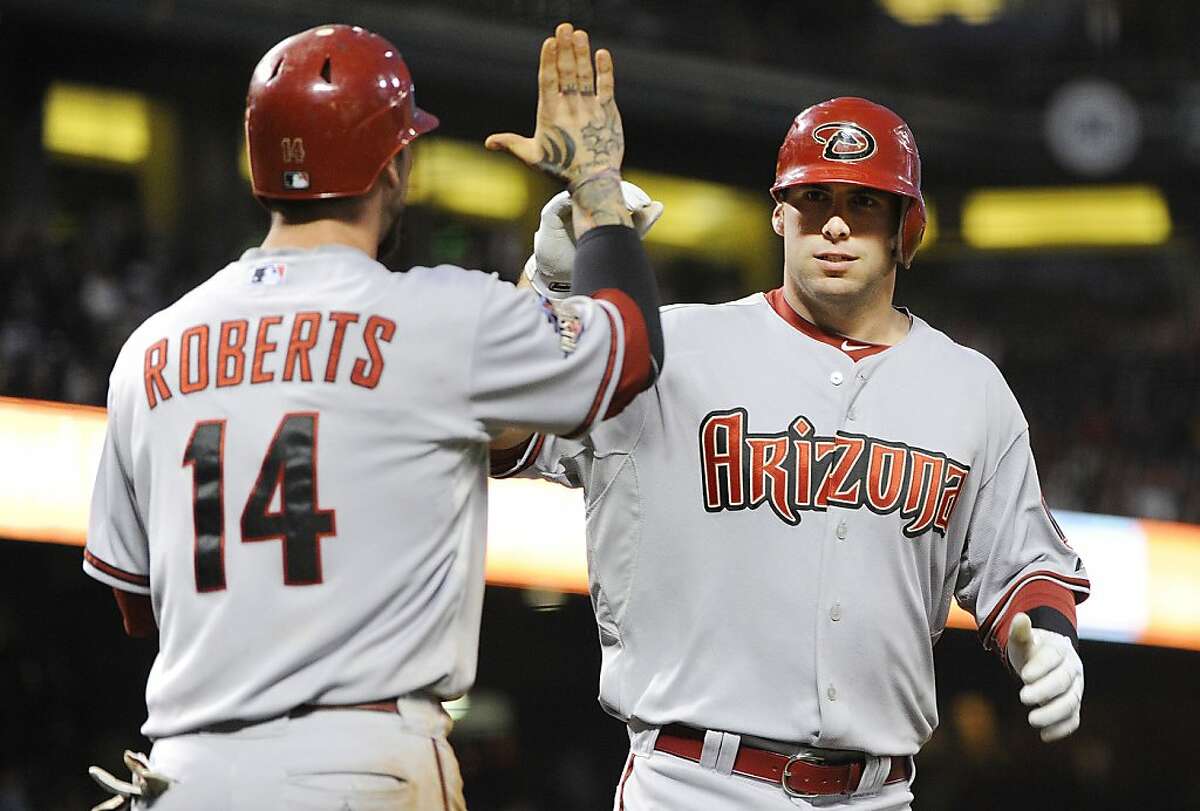 SAN FRANCISCO, CA - AUGUST 2: Paul Goldschmidt #44 of the Arizona Diamondbacks celebrates with Ryan Roberts #14 after hitting a two-run home run against the San Francisco Giants in the fifth inning during an MLB baseball game at AT&T Park August 2, 2011in San Francisco, California.