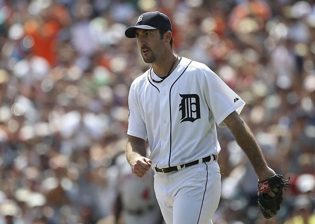 DETROIT - JULY 31: Justin Verlander #35 of the Detroit Tigers reacts after giving up the first hit of the game to Maicer Izturis #13 of the Los Angeles Angels of Anaheim in the eight inning during the game at Comerica Park on July 31, 2011 in Detroit, Michigan. The Tigers defeated the Angels 3-2.