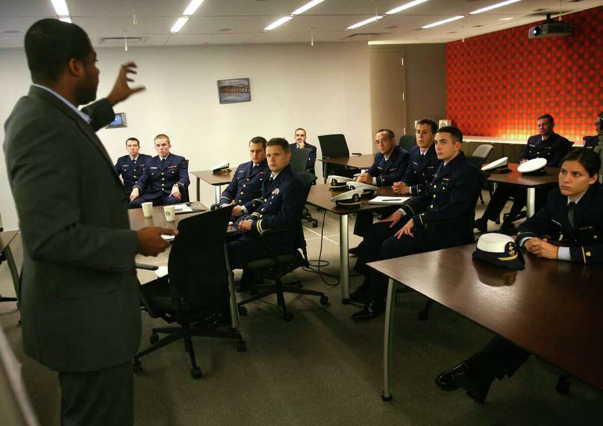 Coast Guard Academy cadets listen to a presentation by Alonzo Ford, senior equity analyst, during a career day visit to G.E. Capital Real Estate in Norwalk on Wednesday, November 20, 2011.