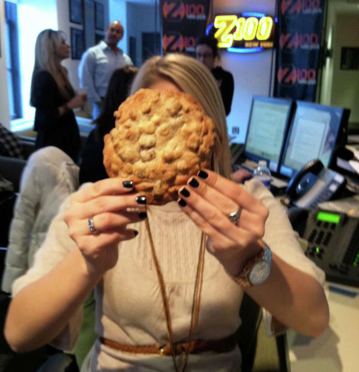In this photo, Carla Marie from Elvis Duran and the Morning Show holds up a "Tripple Threat" Loopie Doops cookie. Photo courtesy of Elvis Duran and the Morning Show's Facebook page.