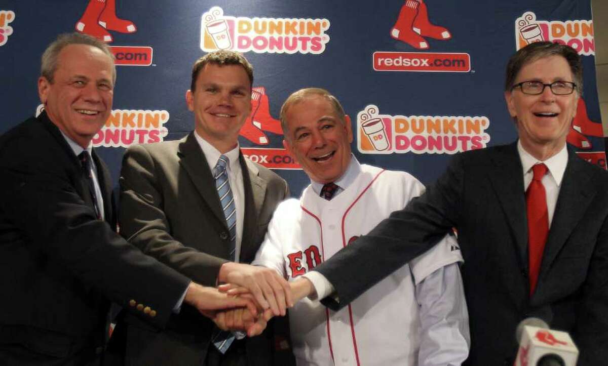 Boston Red Sox first baseman Kevin Youkilis poses with Italian Home News  Photo - Getty Images