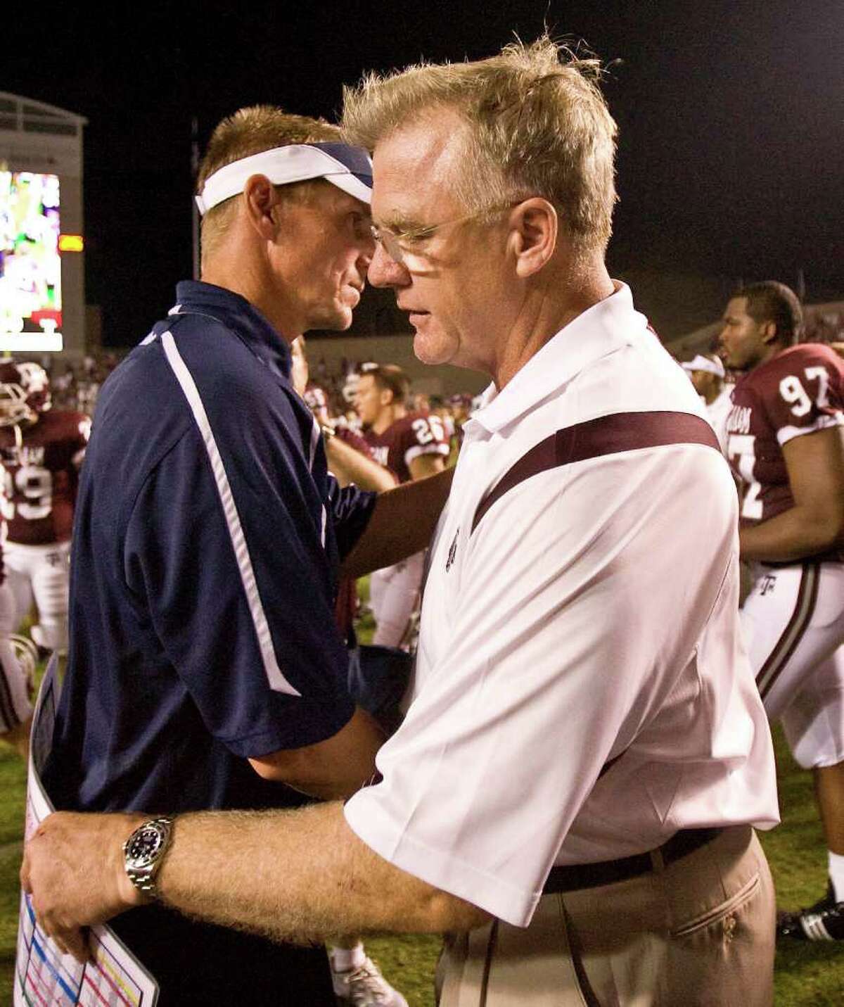 Utah State head coach Gary Andersen, left, congratulates Texas A&M head coach Mike Sherman after their game Saturday, Sept. 19, 2008, in Kyle Field in College Station. Texas A&M won 38-30. ( Nick de la Torre / Chronicle )
