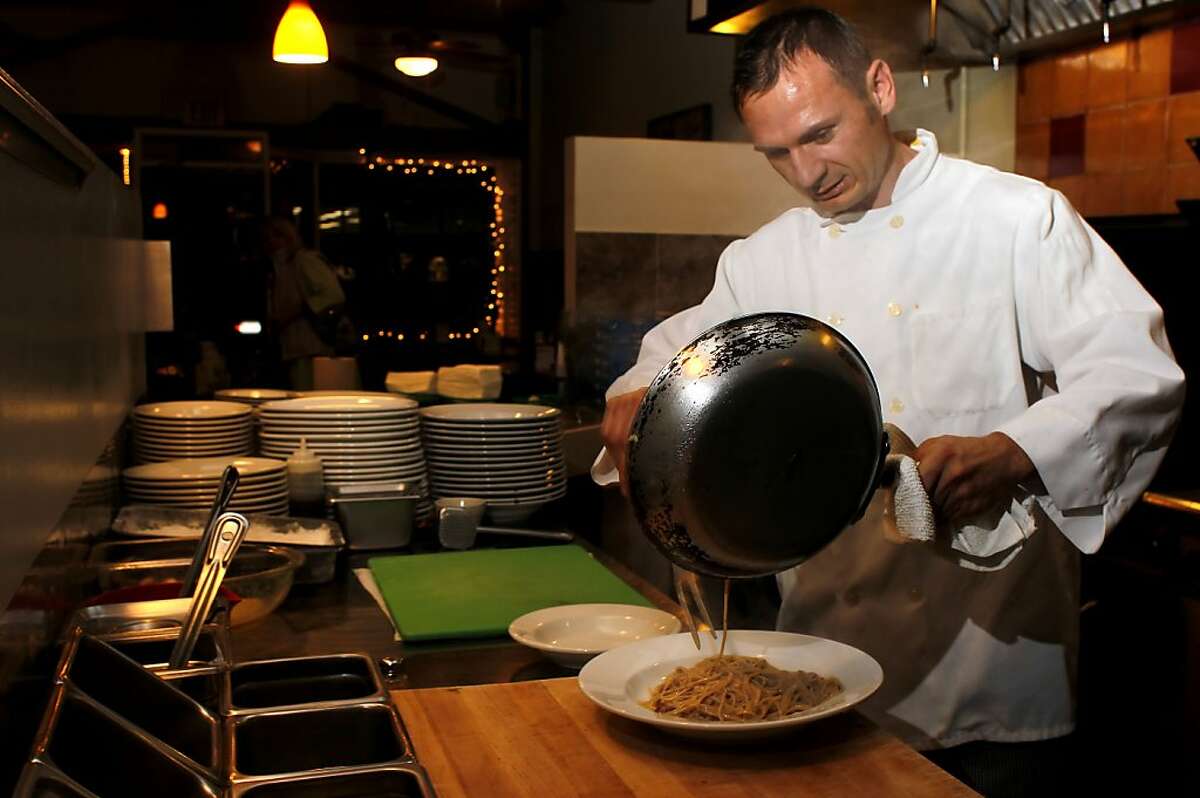 Cook and owner Luca Rocci makes dinner for a customer Monday November 21, 2011, at the Luca Cusina Italiana restaurant in Berkeley, Calif.