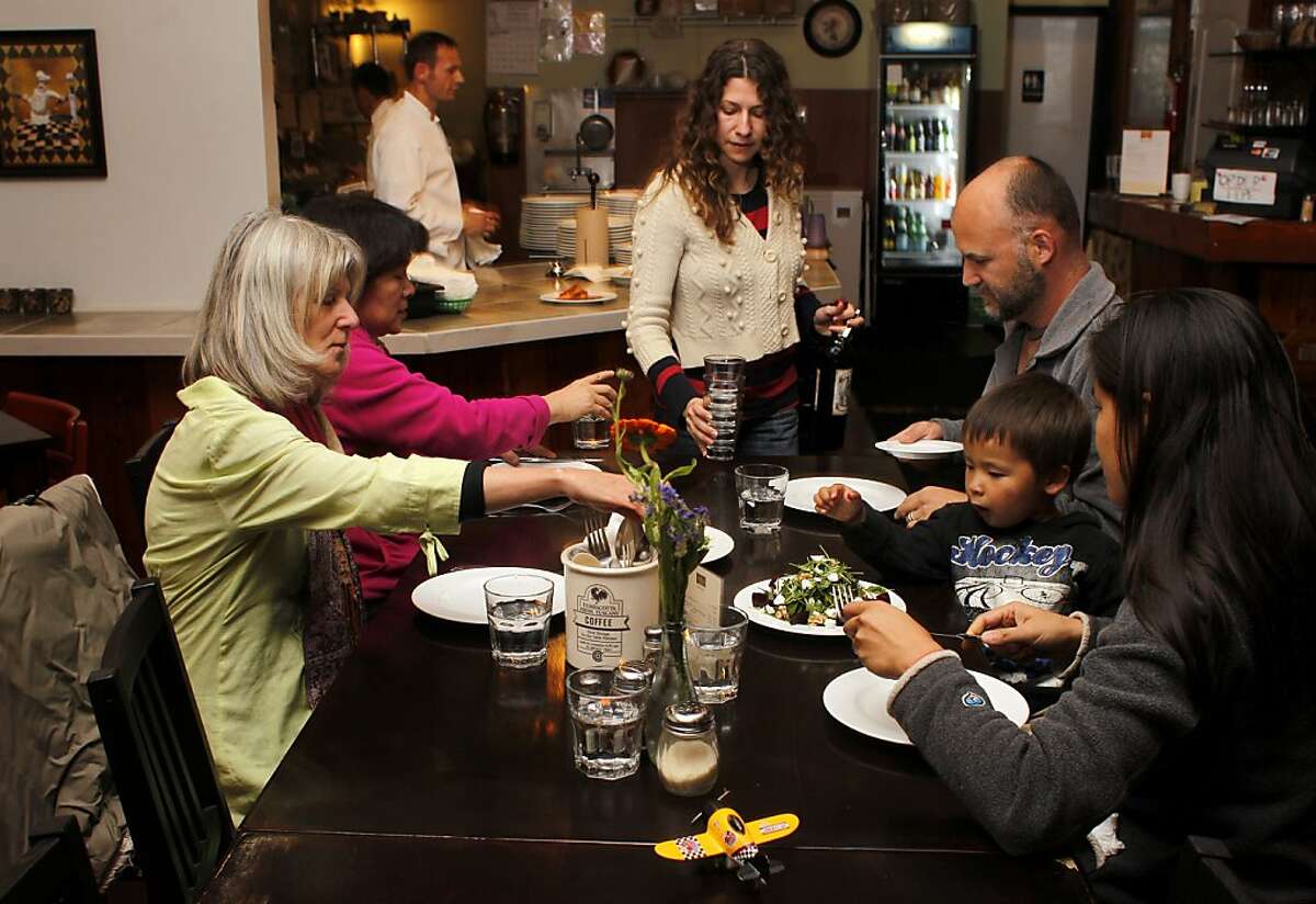 Naomi Silverman serves customers dinner, Monday November 21, 2011, at the Luca Cusina Italiana restaurant in Berkeley, Calif.