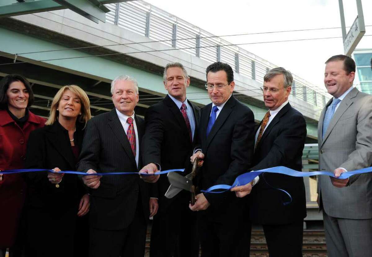Governor Dannel P. Malloy cuts the ribbon on the platform at the new Fairfield Metro Station Friday, Dec. 2, 2011 during a ceremony to mark its official opening. From left, Selectman Cristin McCarthy Vahey, State Rep. Brenda Kupchick, First Selectman Michael Tetreau, Kurt Wittek, managing partner of site developer, Blackrock Realty, DOT commissioner James Redeker and State Senator John McKinney.