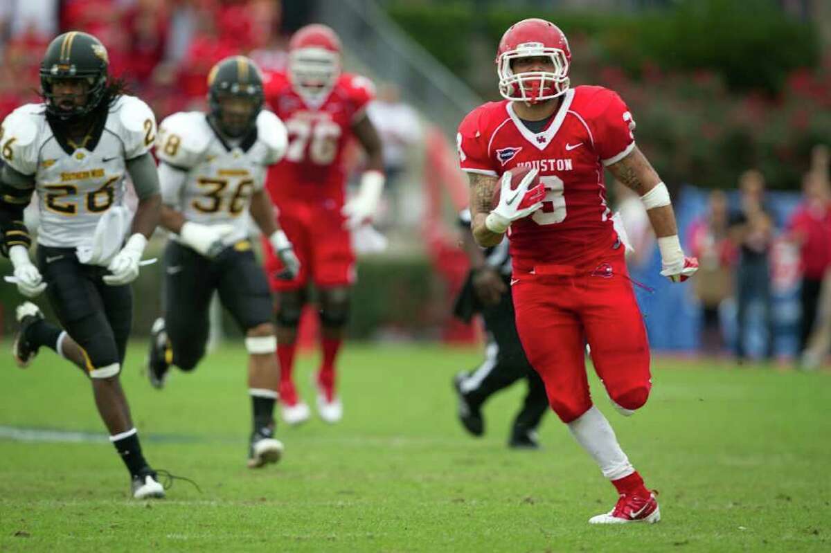 Houston Cougars wide receiver Justin Johnson (3) races for a long gain to set up a touchdown against Southern Mississippi during the first half of the C-USA Championship at Robertson Stadium, Saturday, Dec. 3, 2011, in Houston. ( Smiley N. Pool / Houston Chronicle )