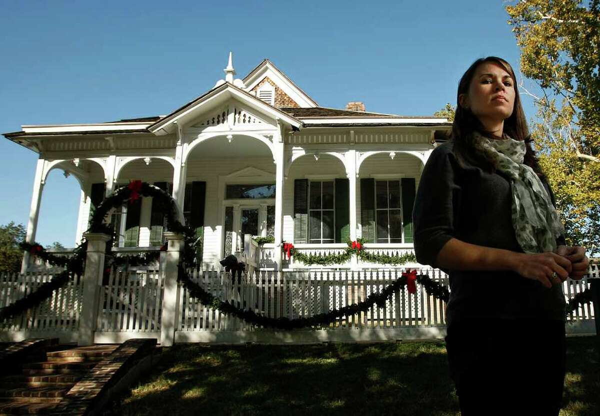 JOHNNY HANSON PHOTOS : CHRONICLE DIFFICULT ASSIGNMENTS: Kimberly Wolfe, a native of Denton, is now the buildings curator for the Heritage Society. Each week, she visits some of the city's most historic structures, including the Pillot House, shown, to check for damages.