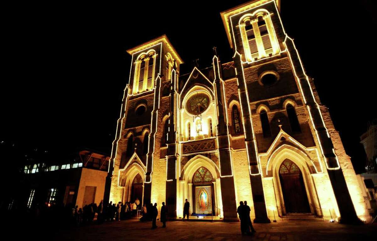 An image of Our Lady of Guadalupe graces the main door of San Fernando Cathedral as people line up to pay her respects on the eve of her feast day on Thursday night, Dec. 11, 2008. Catholics celebrate the date as the anniversary of her appearance in Mexico in the year 1531.