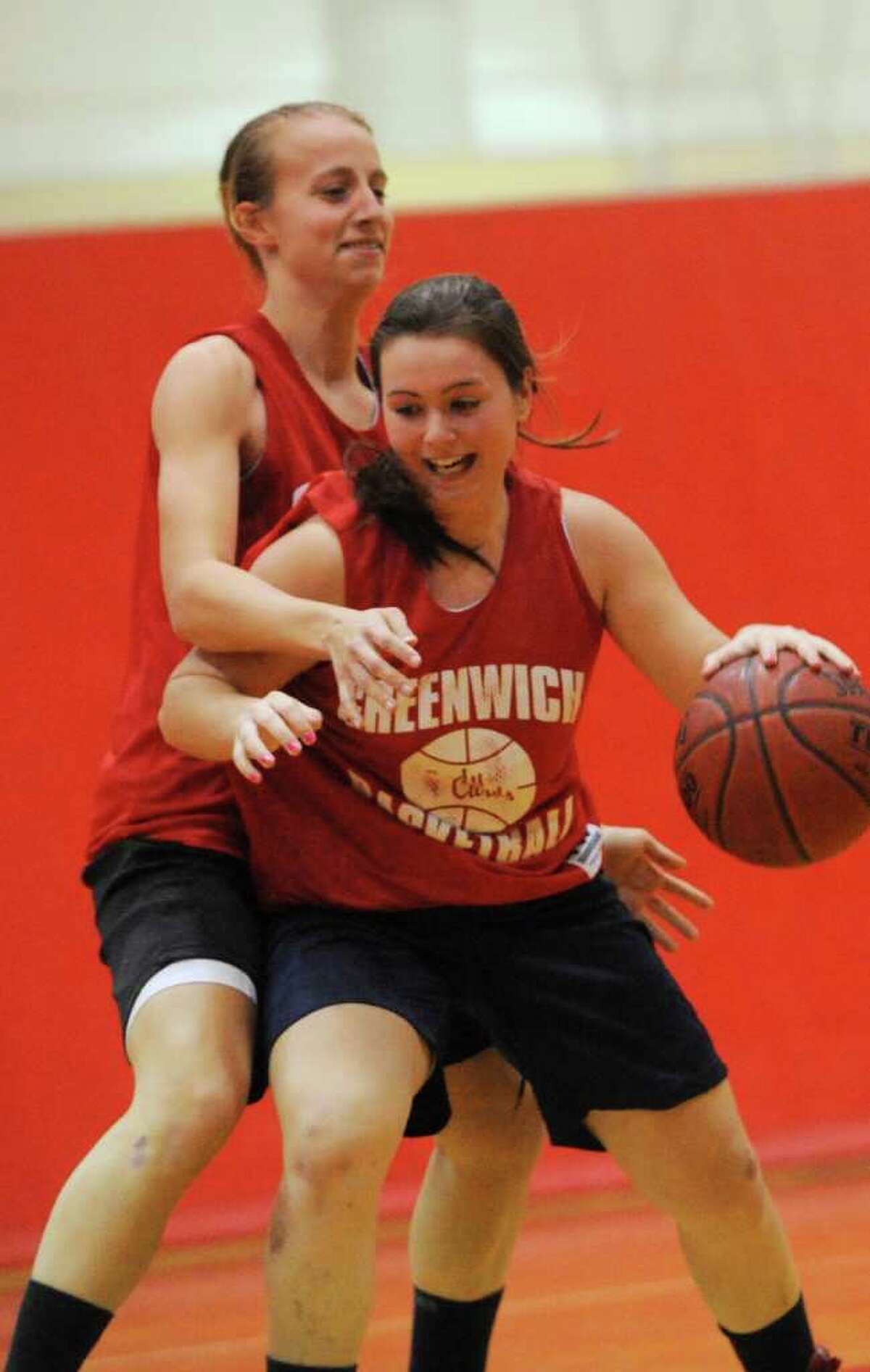 Amanda Onofrio, co-captain, left, with Erica Ambrogio in a practice at Greenwich High girls basketball Monday, Dec. 5, 2011.