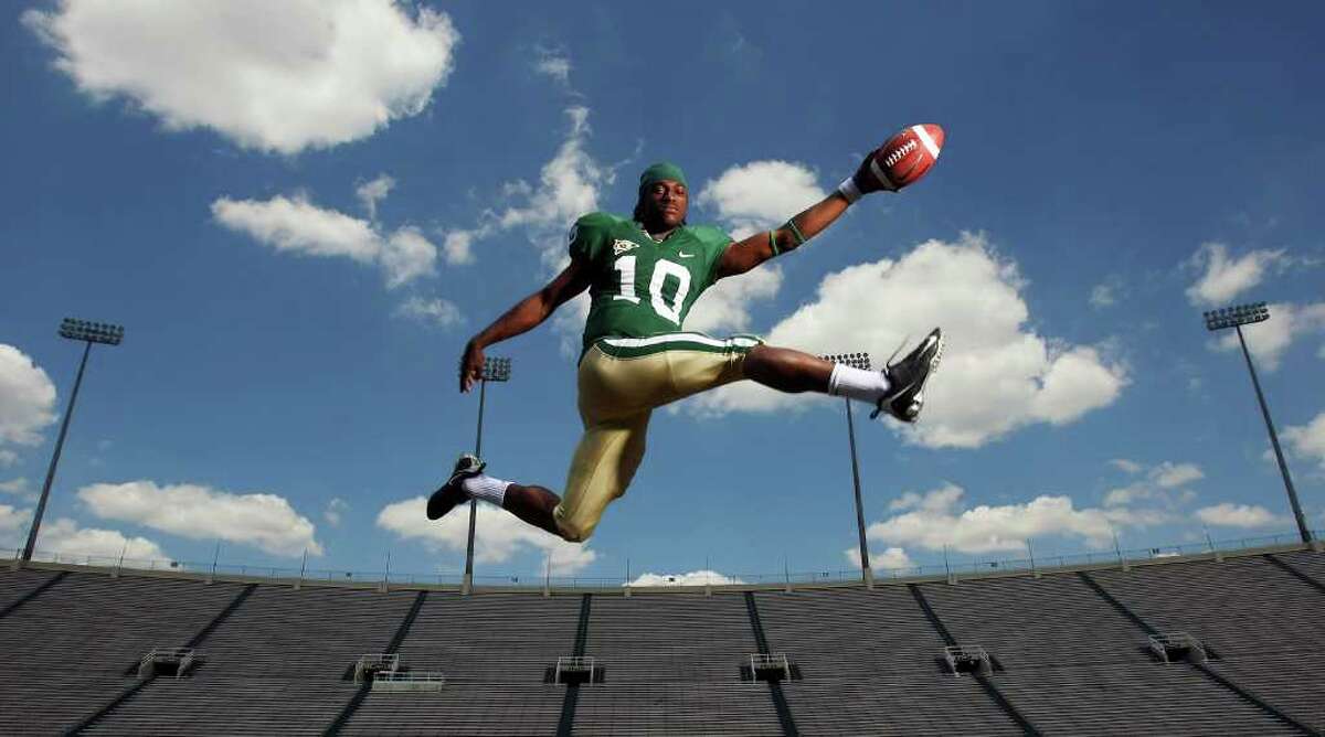 Baylor's quarterback Robert Griffin soars for a portrait, May 21, 2009, at Floyd Casey Stadium in Waco.