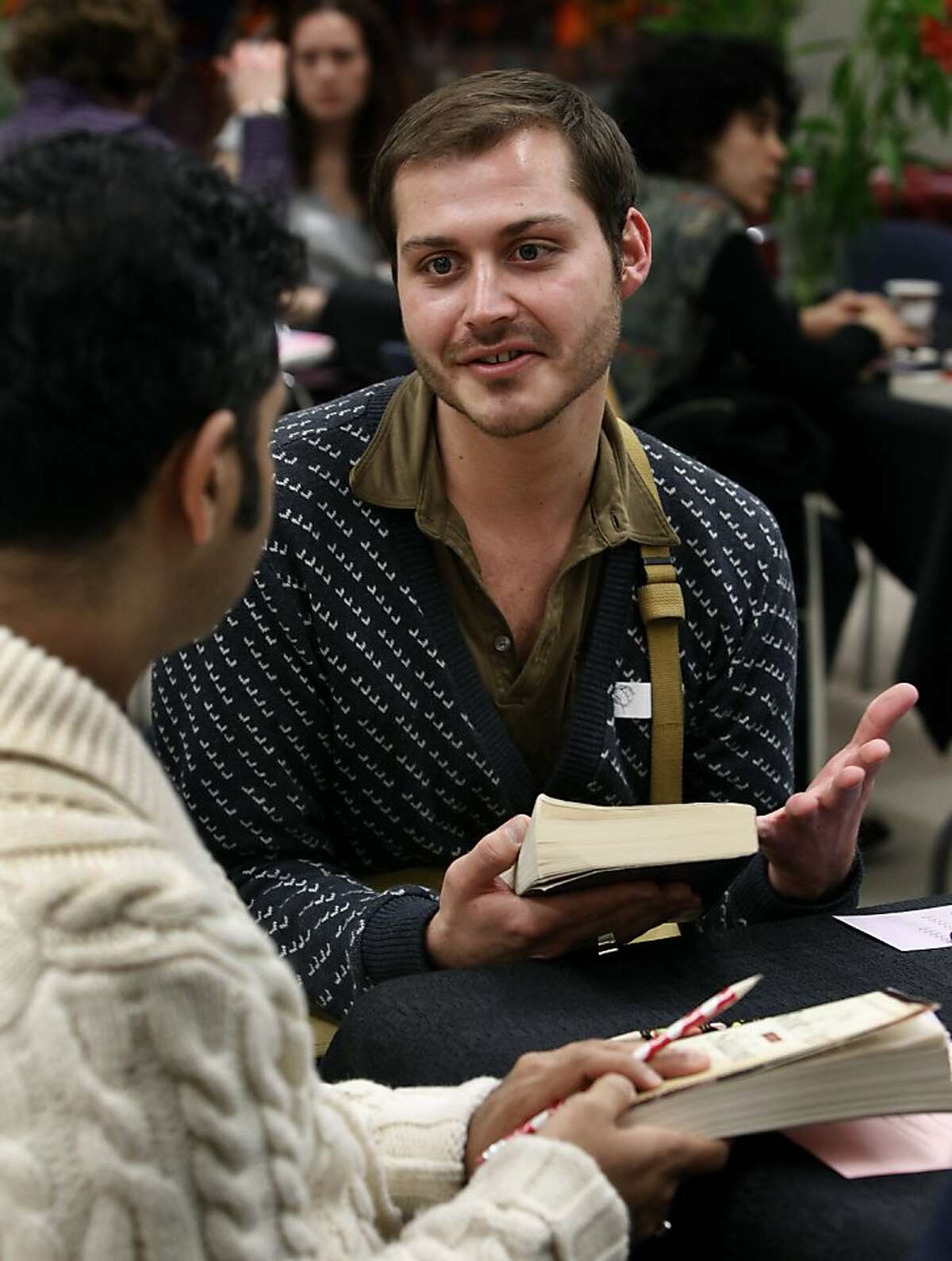 Blake Love meets Ameet Kamath (left) at an LGBT speed dating event at the Main Library in San Francisco, Calif., on Wednesday, Feb. 2, 2011. Participants were encouraged to bring their favorite book as a conversation starter.