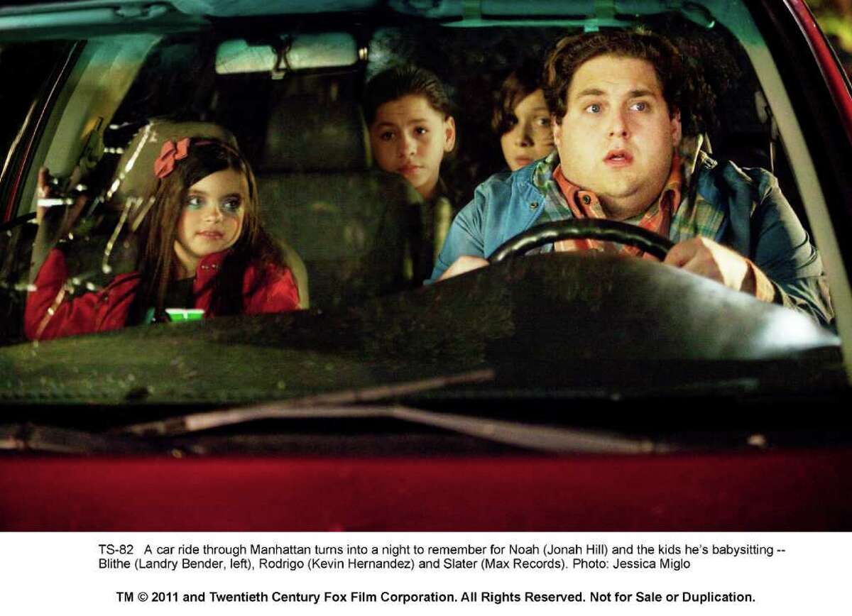 Driver Jonah Hill and the kids, Landry Bender (left), Kevin Hernandez and Max Records, take a fateful spin.