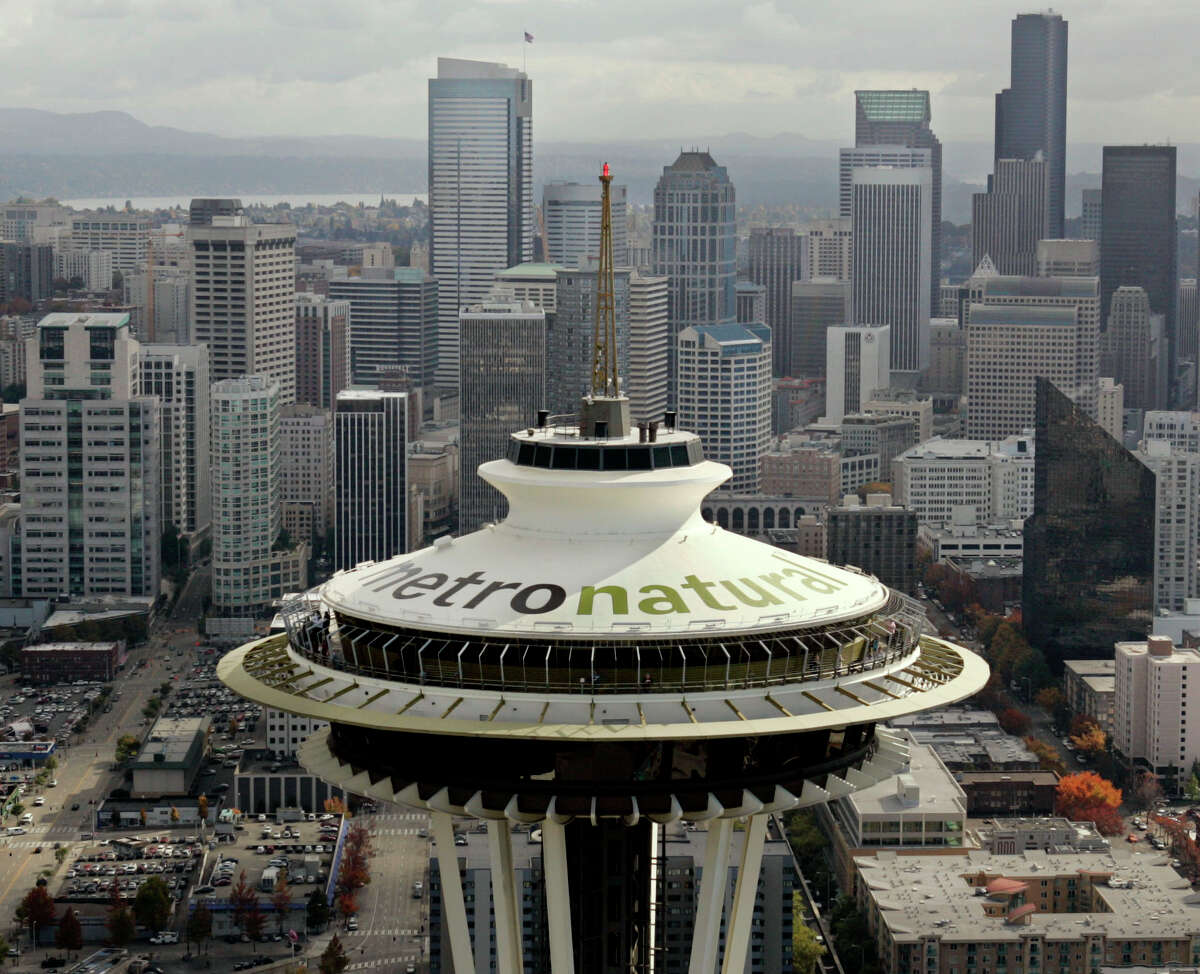 Letters 18-feet tall proclaiming Seattle's newest tourism slogan, "metronatural," are seen atop the landmark Space Needle on Oct. 20, 2006. The new tagline had been unveiled earlier in the day by the Seattle Convention and Visitors Bureau to promote the city.