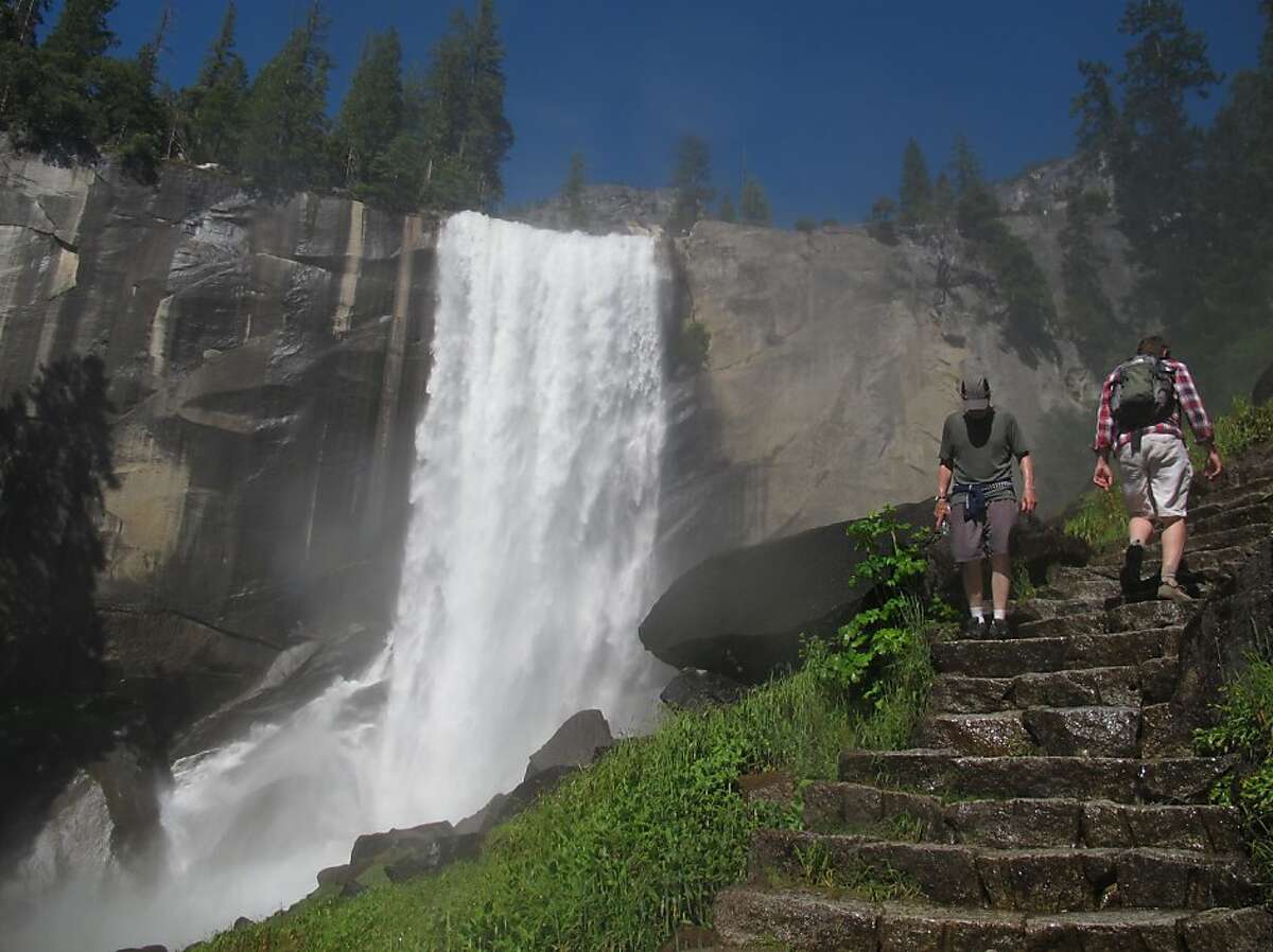 Hikers on the Mist Trail to Vernal Fall in Yosemite are seen Wednesday July 20, 2011. A man and a woman crossed a metal barricade above the 317-foot Vernal Fall on Tuesday, making their way over slick granite to a rock on the edge of the swift Merced River trying to pose for a picture. Instead they burned a horrifying image into the memories of everyone who saw.