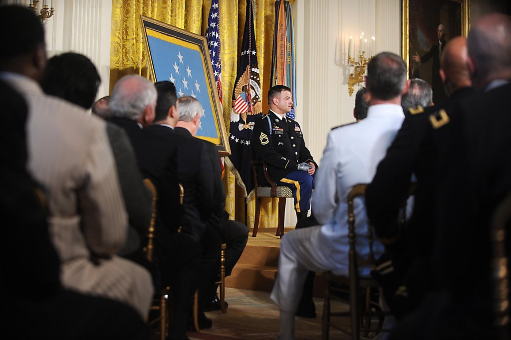 Army Sgt. 1st Class Leroy Arthur Petry applauds during a ceremony at the  White House in