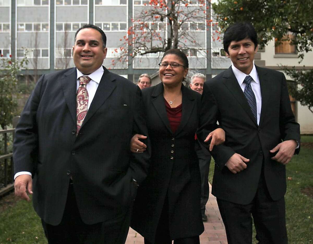 Assembly Speaker Karen Bass, D-Los Angeles walks arm-in-arm with fellow Assembly Democrats Kevin De Leon, right, and John Perez, both from Los Angeles, after was Perez selected to become the next speaker of the California Assembly in Sacramento, Calif., Thursday, Dec. 10, 2009. Democrats met for over an hour before announcing the selection of Perez, who will be the first openly gay Assembly Speaker, over De Leon. The nomination will now go before the full Assembly for a final vote, in January.(AP Photo/Rich Pedroncelli)