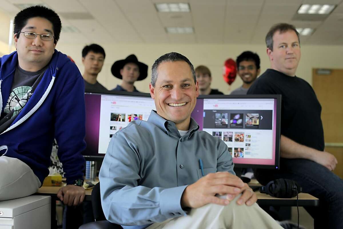 Christos Goodrow, center, head of engineering for YouTube's search and discovery team, Michael Ogawa, left, Yintao Liu, John Kraemer, Mike Yurko, Dasavathi Sampath, Bill Saphir, sit at their office, Tuesday July 27, 2011, in San Bruno, Calif.