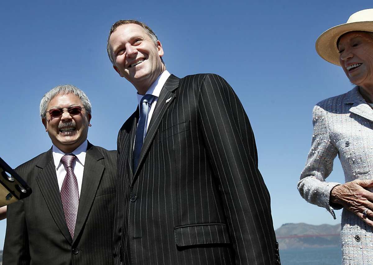 San Francisco Mayor Ed Lee (left) and Prime Minister John Key (center) laugh at a question by a reporter as city chief of protocol Charlotte Shultz is at right. San Francisco Mayor Ed Lee welcomed the Prime Minister of New Zealand to San Francisco Wednesday July 20, 2011. The two discussed the recent earthquakes in New Zealand and America's Cup.