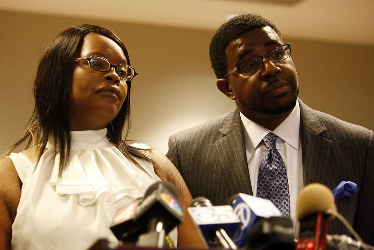 Denika Chatman, Kenneth Harding's mother, and Adante Pointer answer questions during the press conference on July 25, 2011. The family of Kenneth Harding -- the man shot to death in the Bay View last week, allegedly by himself after he shot at police -- held a press conference in the offices of attorney John Burris, whom they have retained to presumably file a lawsuit.