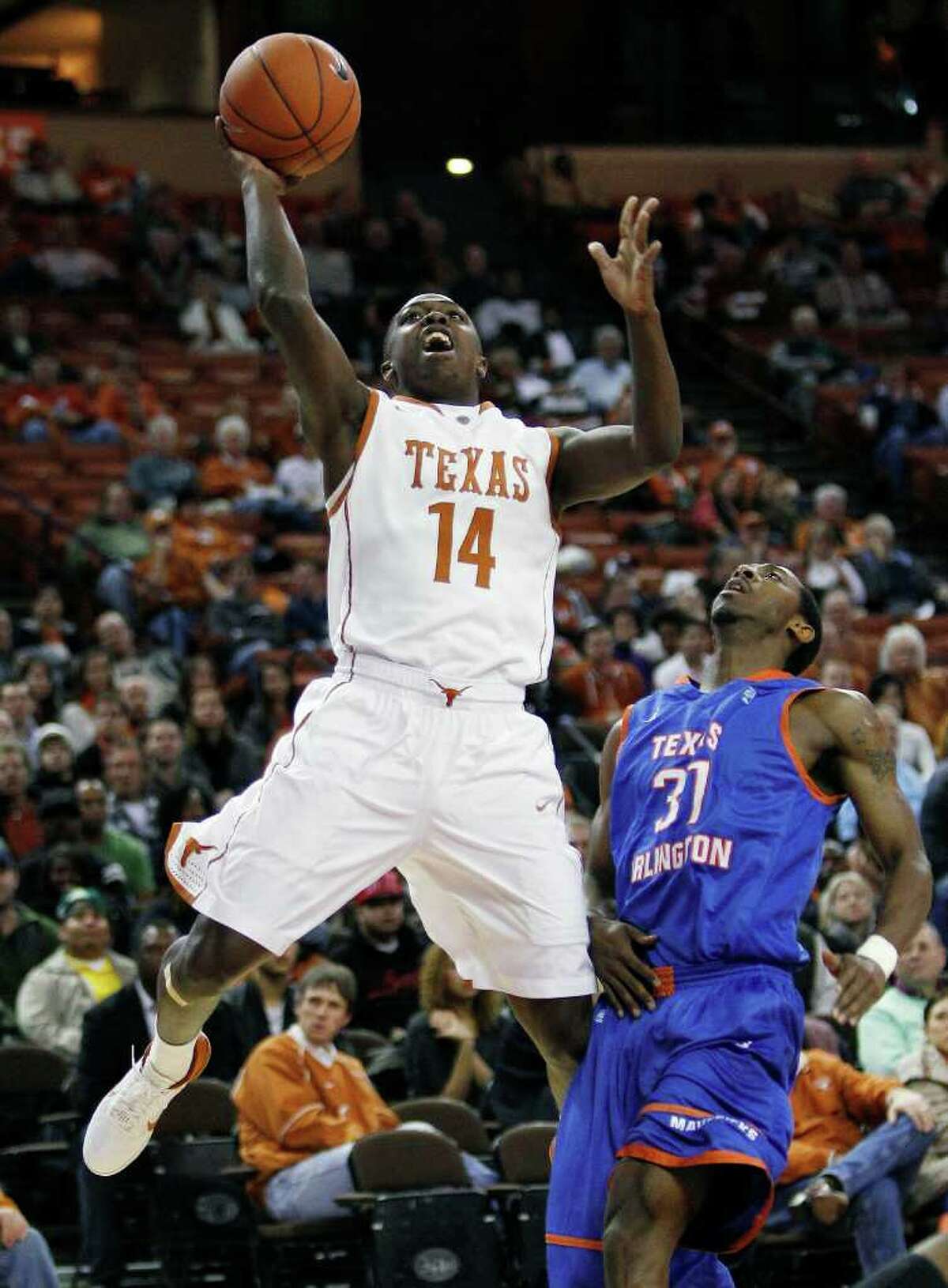 Texas guard J’Covan Brown puts up a shot over Texas-Arlington’s LaMarcus Reed III during the first half Tuesday night at the Erwin Center.
