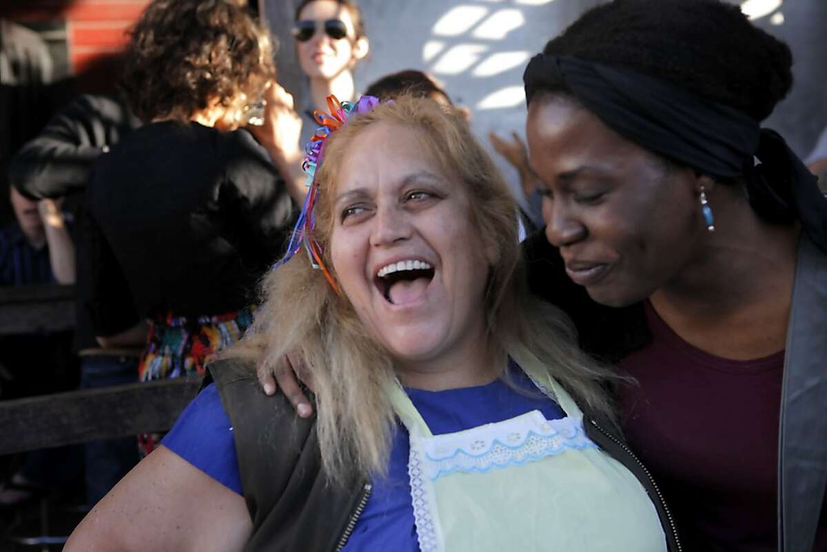 Virginia Ramos, left, also known as the Tamale Lady, gets a hug from Rama Kangas-Kent at her birthday party put on by Zeitigeist Bar, Monday June 21, 2010, in San Francisco, Calif. The bar has been throwing birthday parties for Ramos since 2003 because it is one of it favorite haunts.