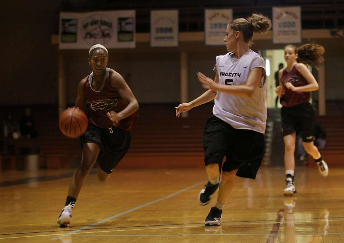 Lauren Westbrook of CSU Maritime tries to slow down Future Stanford player Jasmine Camp as she races down the court in a San Francisco Bay Area Women's Pro-Am league game in San Francisco Calif., on July 9, 2011.