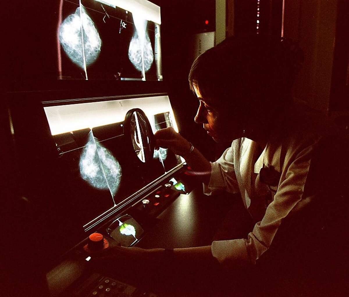 Dr. Deborah Kass of Kaiser Permanente reviews mammograms on the Imagechecker in May 1997.